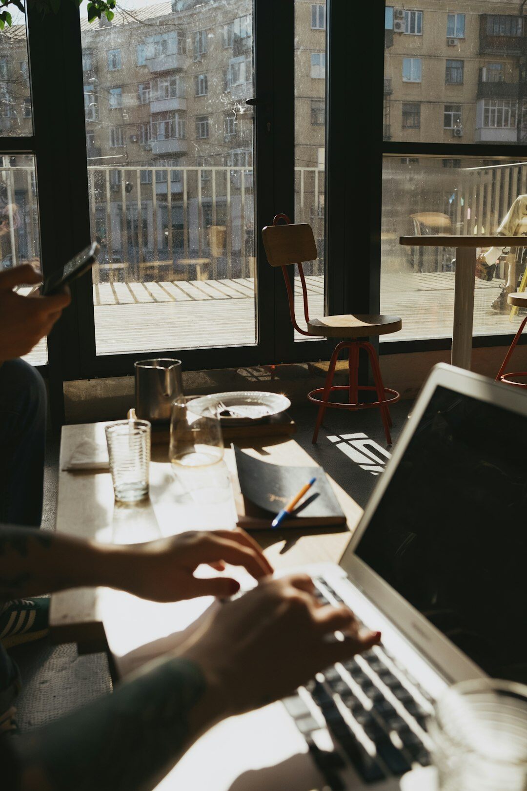 person working on laptop in cafe