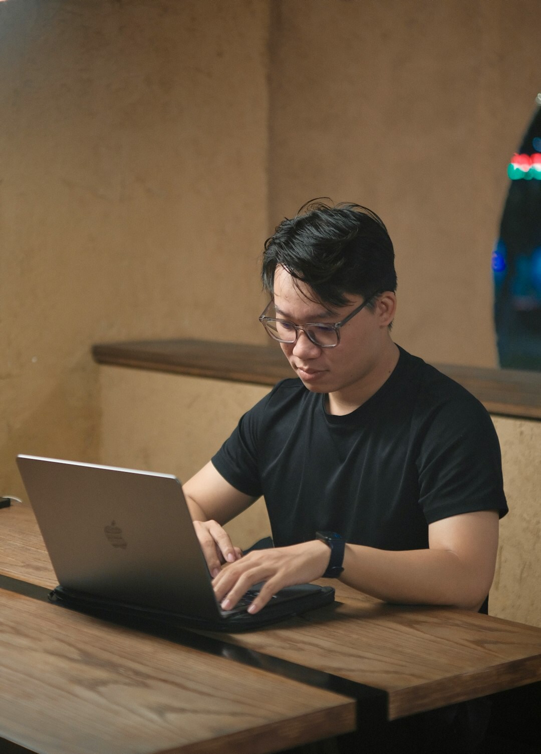 japanese student coding on laptop
